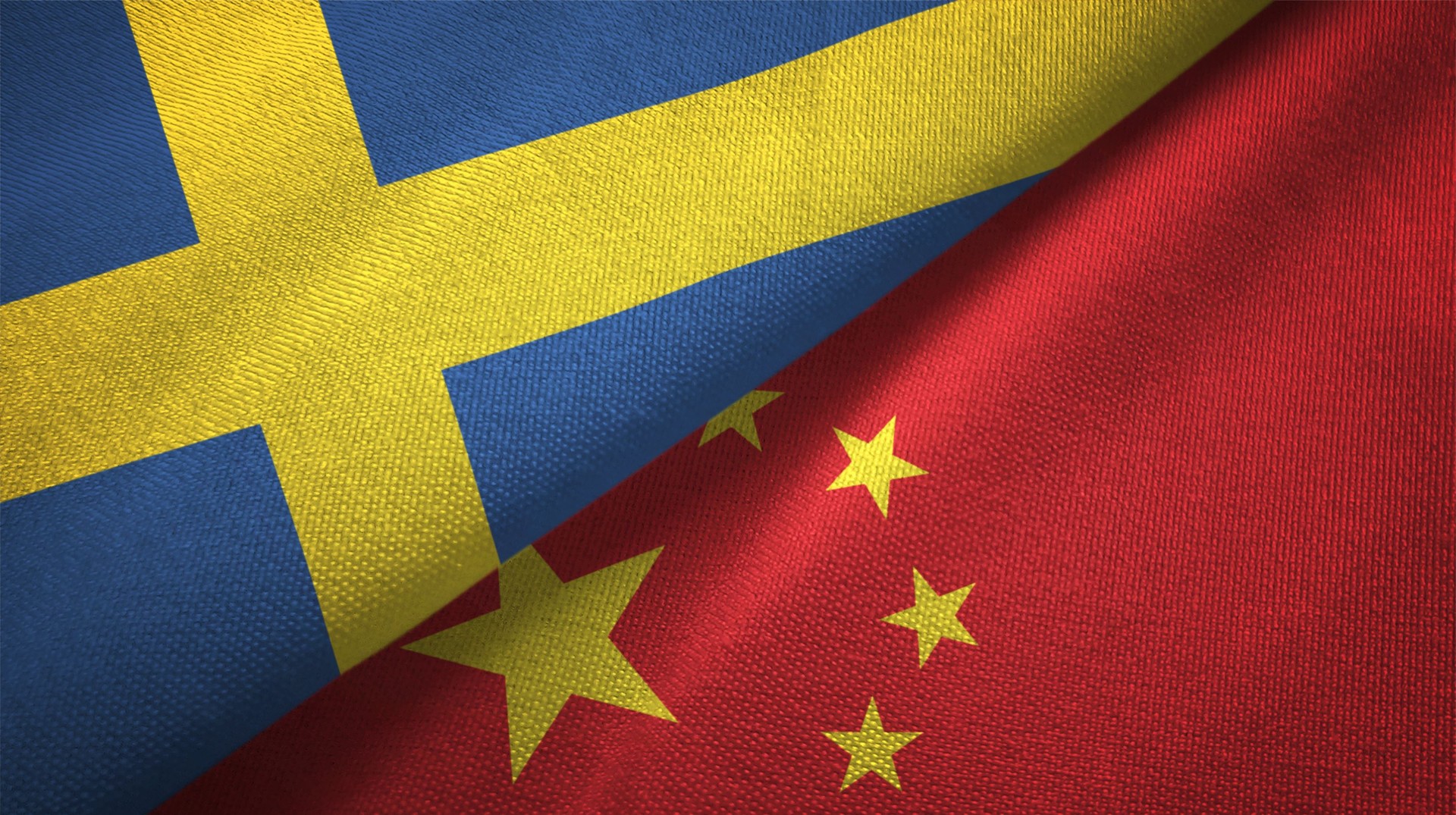 China and Sweden two flags together textile cloth fabric texture
